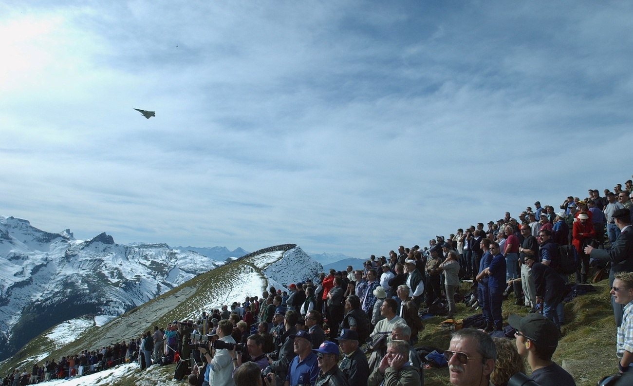 fighter jet over a mountain