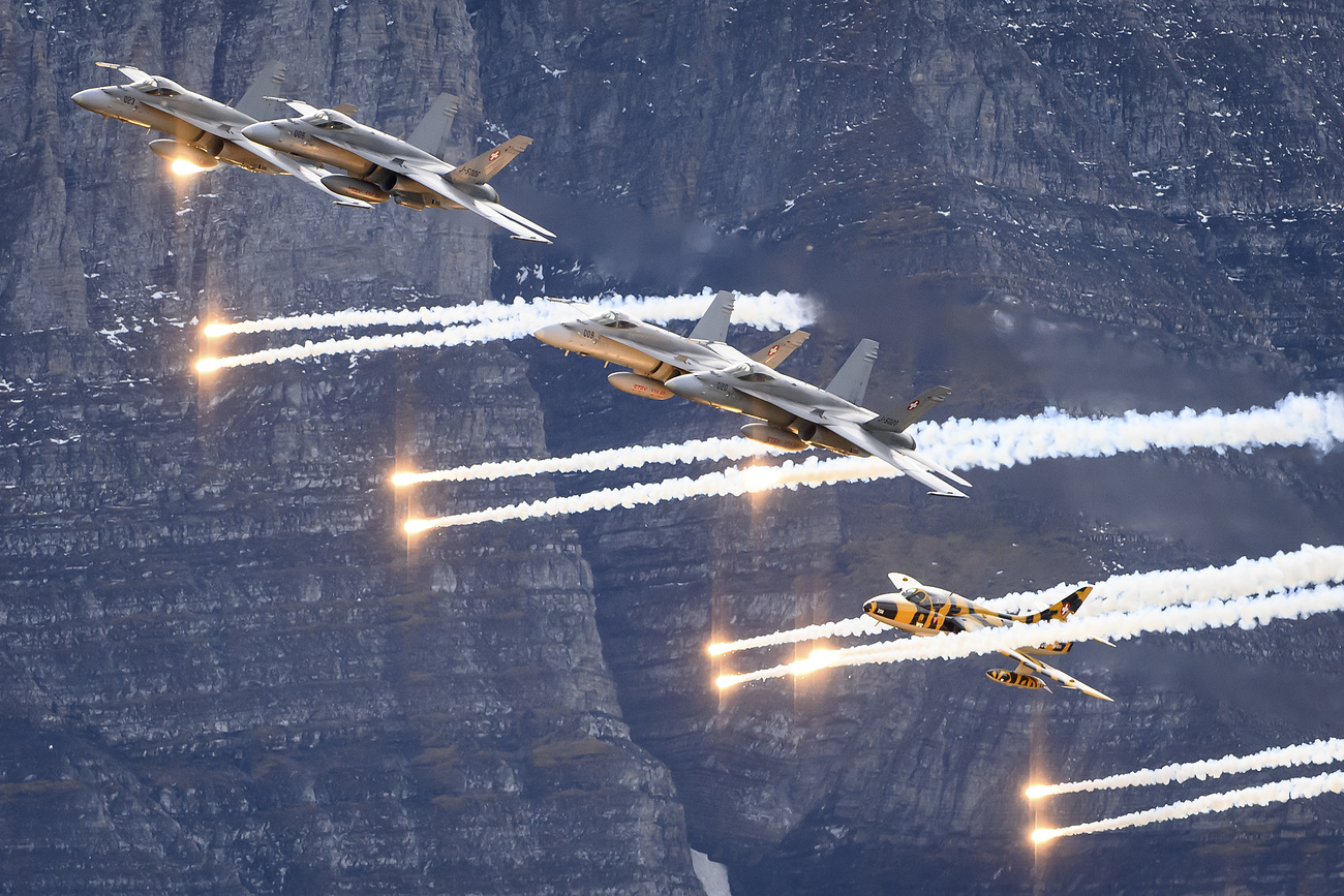 Swiss fighter jets drop flares during the annual Swiss army airshow near Meiringen, Switzerland, in 2021.