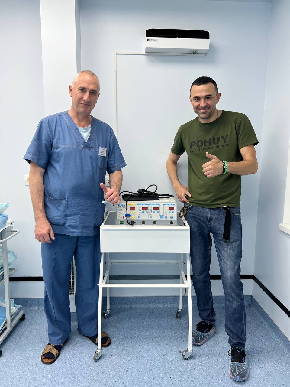 Stepan Borzov and Yevhen Kalenda with electrosurgical unit in Dnipro
