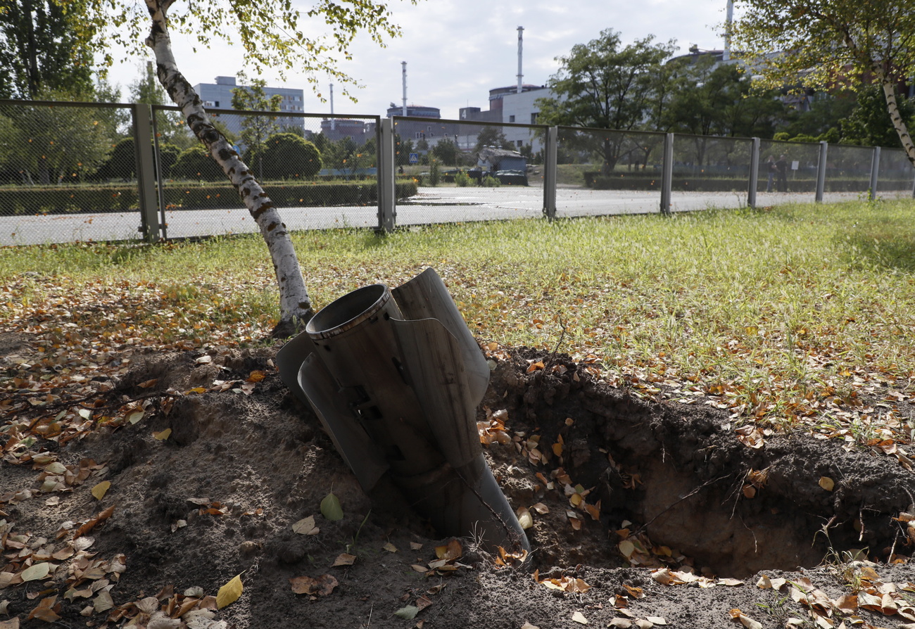 A rocket in the ground in front of Zaporizhzhia nuclear power plant in Ukaine.