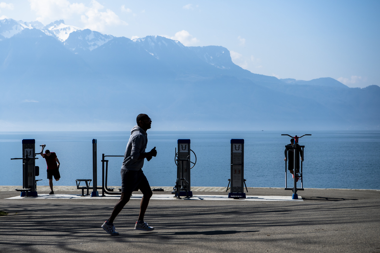 man running with mountain in the background
