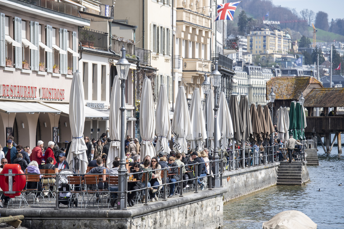 crowds on lakeside quay in city