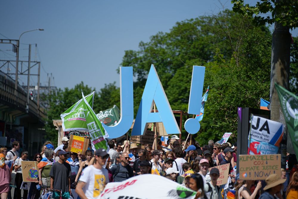 Climate Strike demonstrators call on the Swiss to say yes to new climate law in Bern