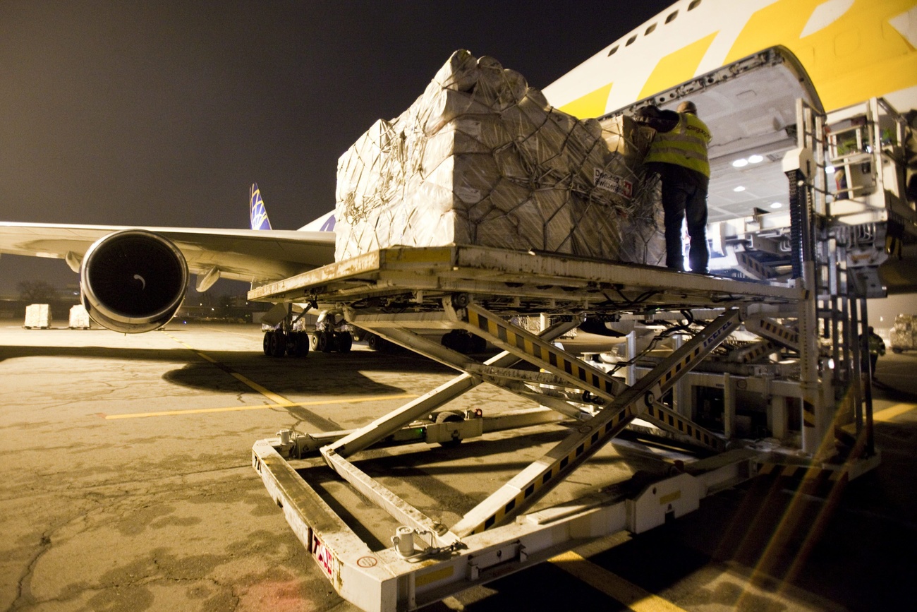 Chartered civilian aircraft: Swiss earthquake relief supplies are loaded onto Haiti in 2010.