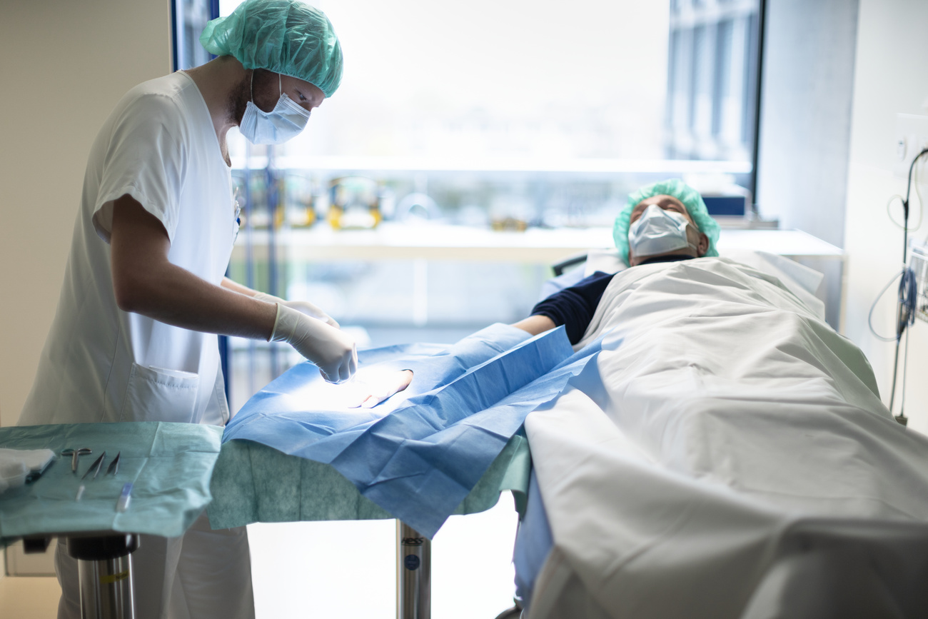 Doctor treating patient at hospital in Zurich