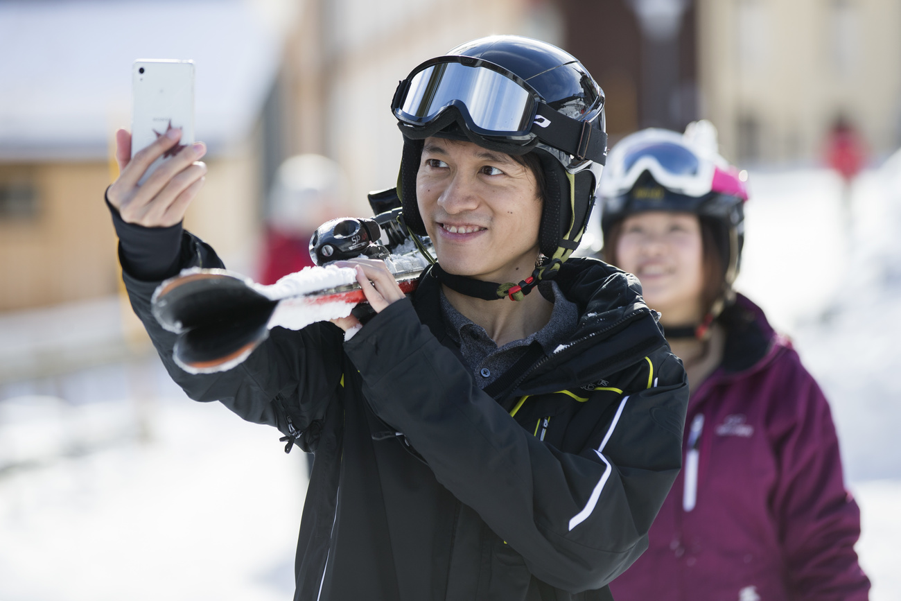 Chinese tourists on Swiss ski slope
