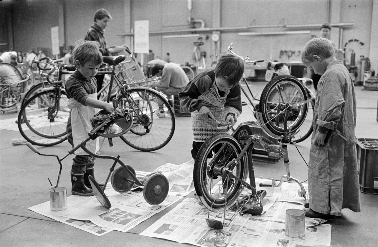 children repairing bicycles