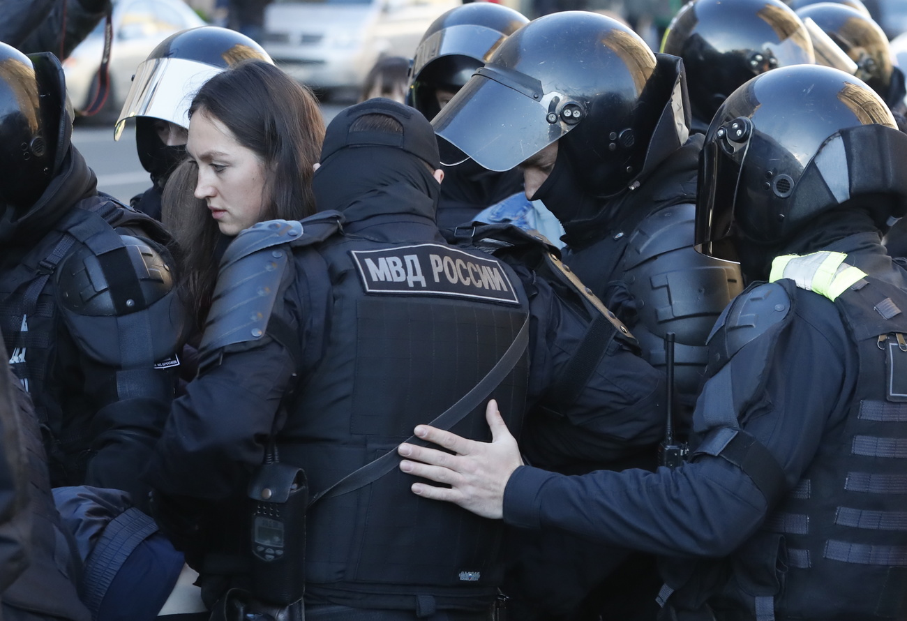 Russian police arrest a woman protesting against the Ukraine war