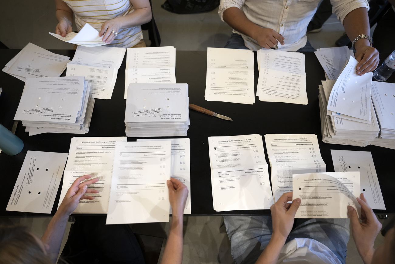 Picture of people s hands and vote papers