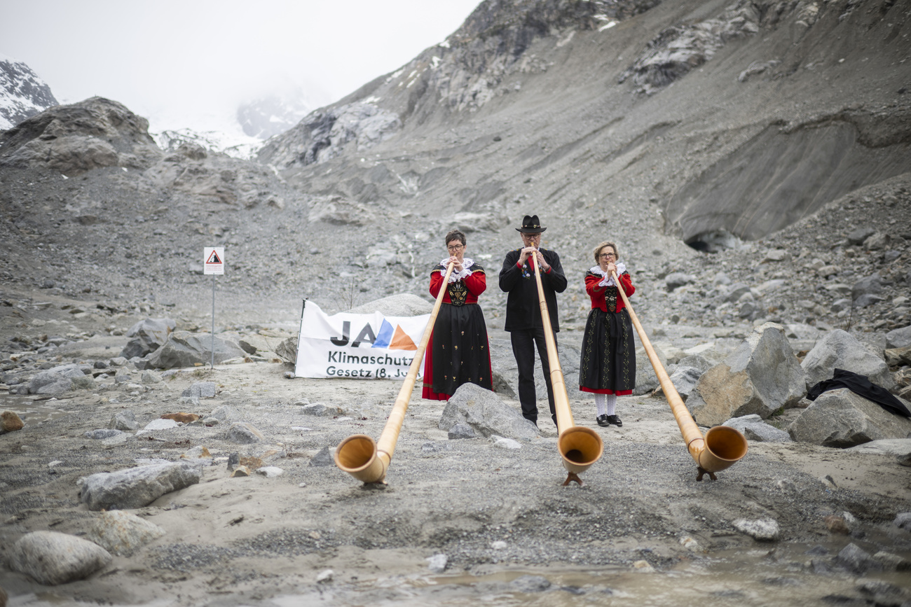 Alphorn players in Alps