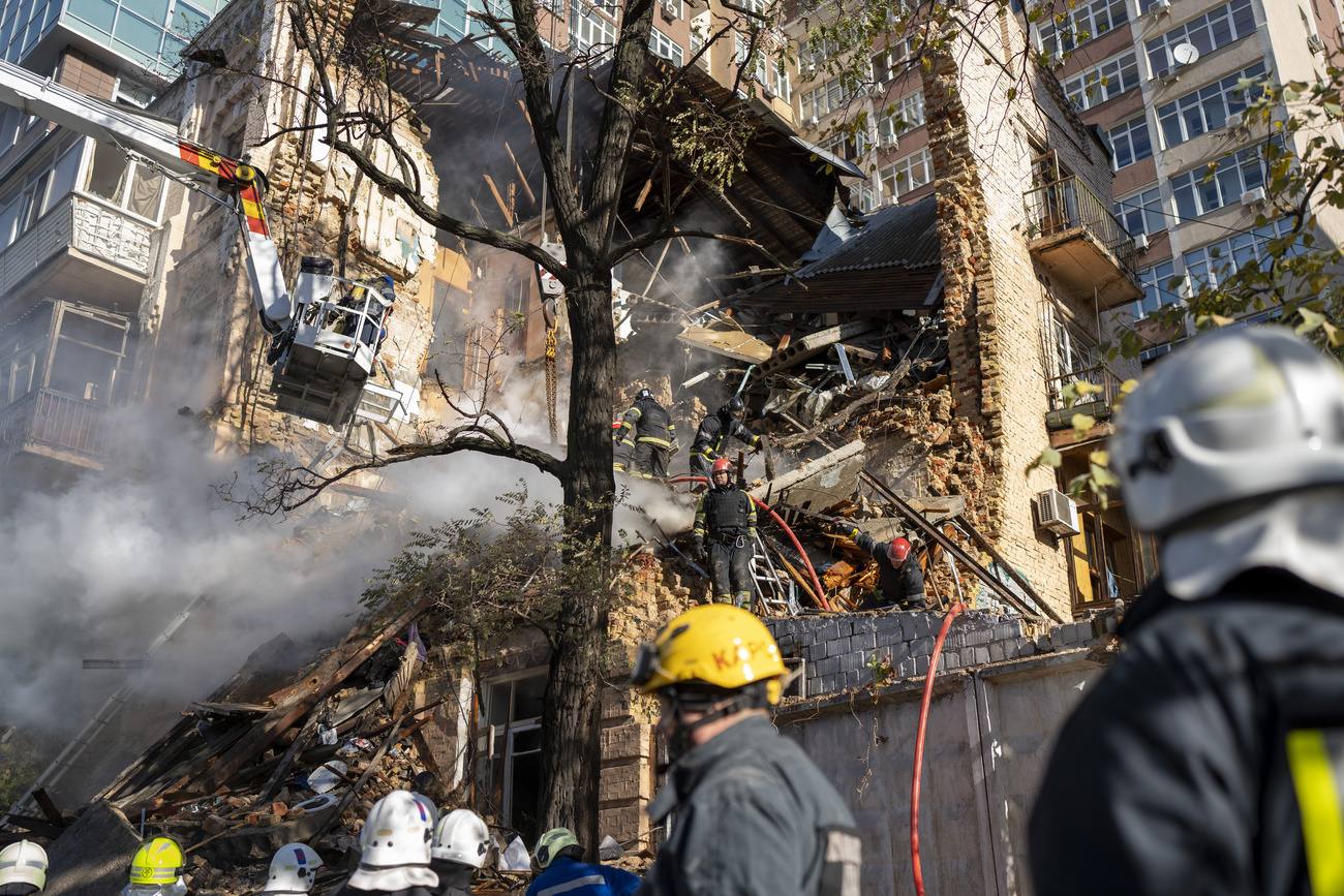 the remnants of an apartment building in Ukraine after a Russian drone strike