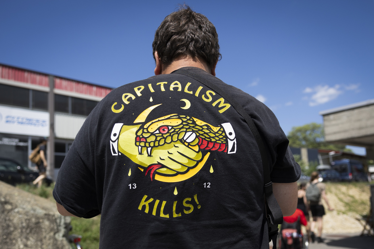 Anarchist at the St Imier event in Switzerland wearing t-shirt inscribed with the slogan: Capitalism Kills.