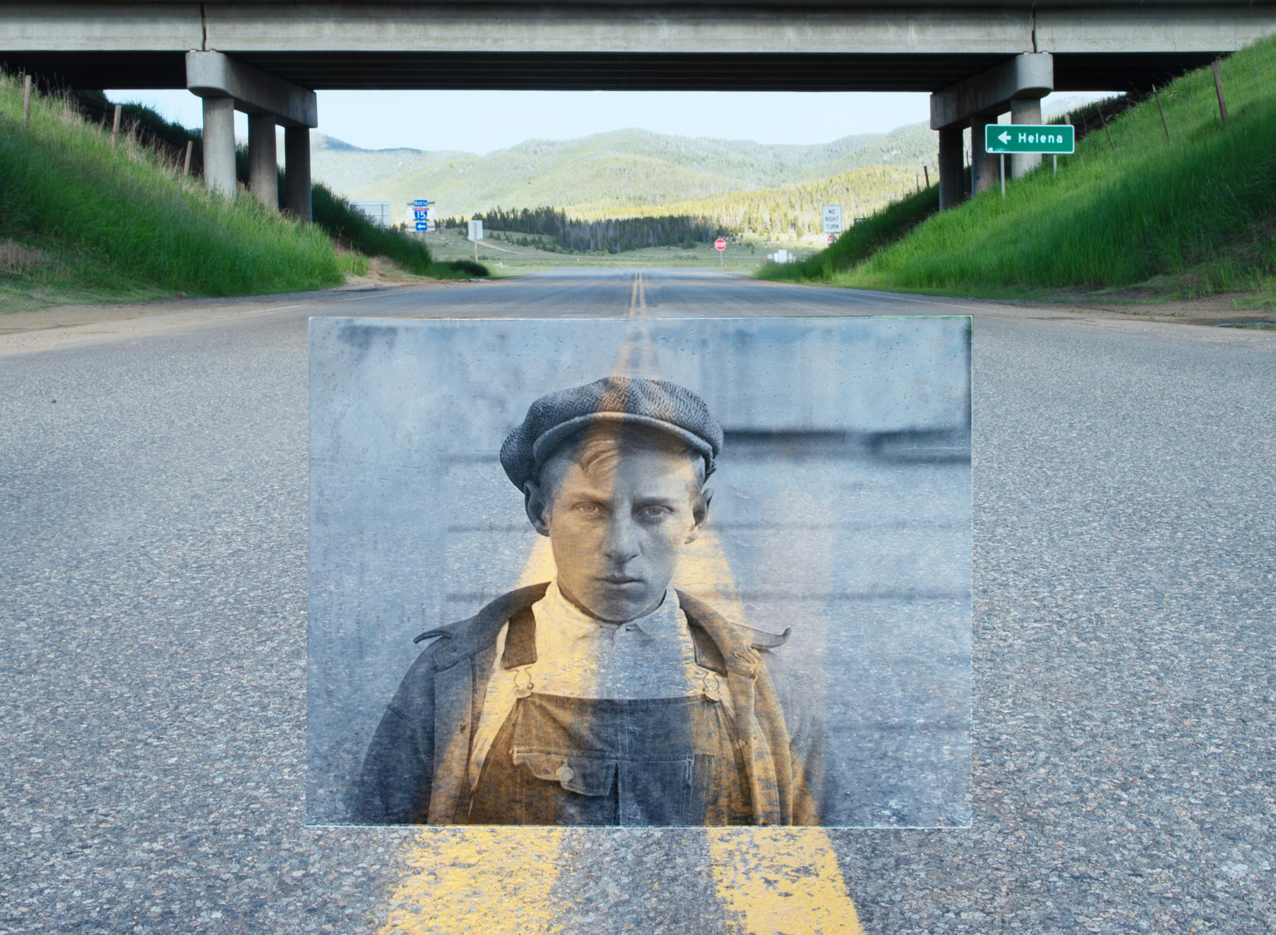 Photo of a boy, in the background a highway.