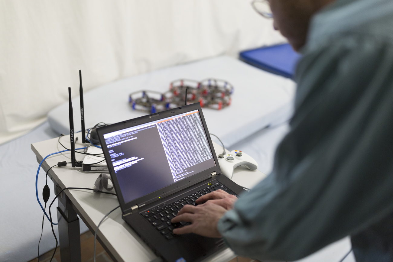 Scientist working on drone research on a laptop