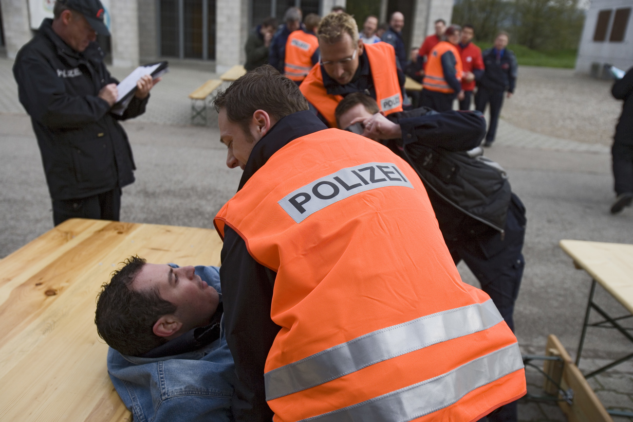 Swiss police being trained to restrain people whilst being filmed.