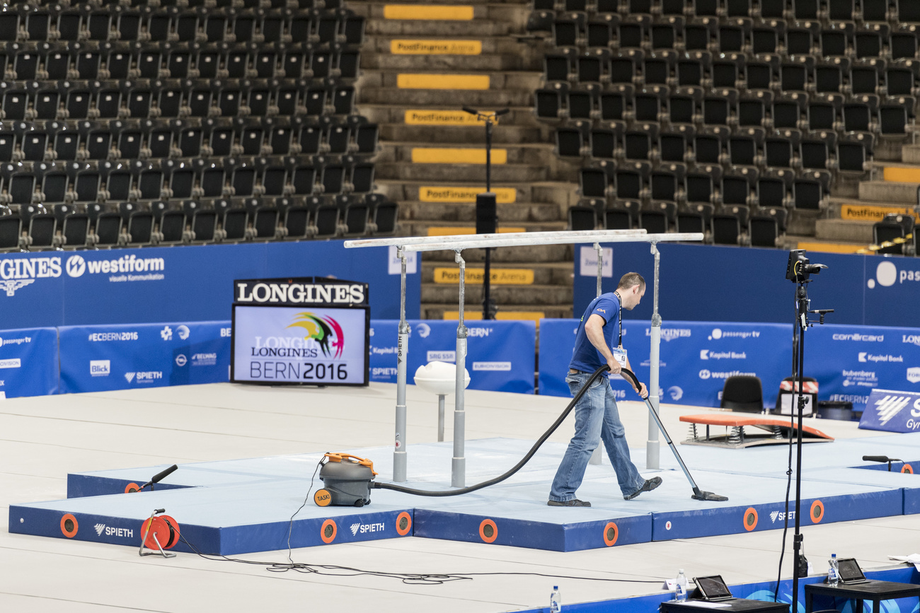 Man vacuums a stadium