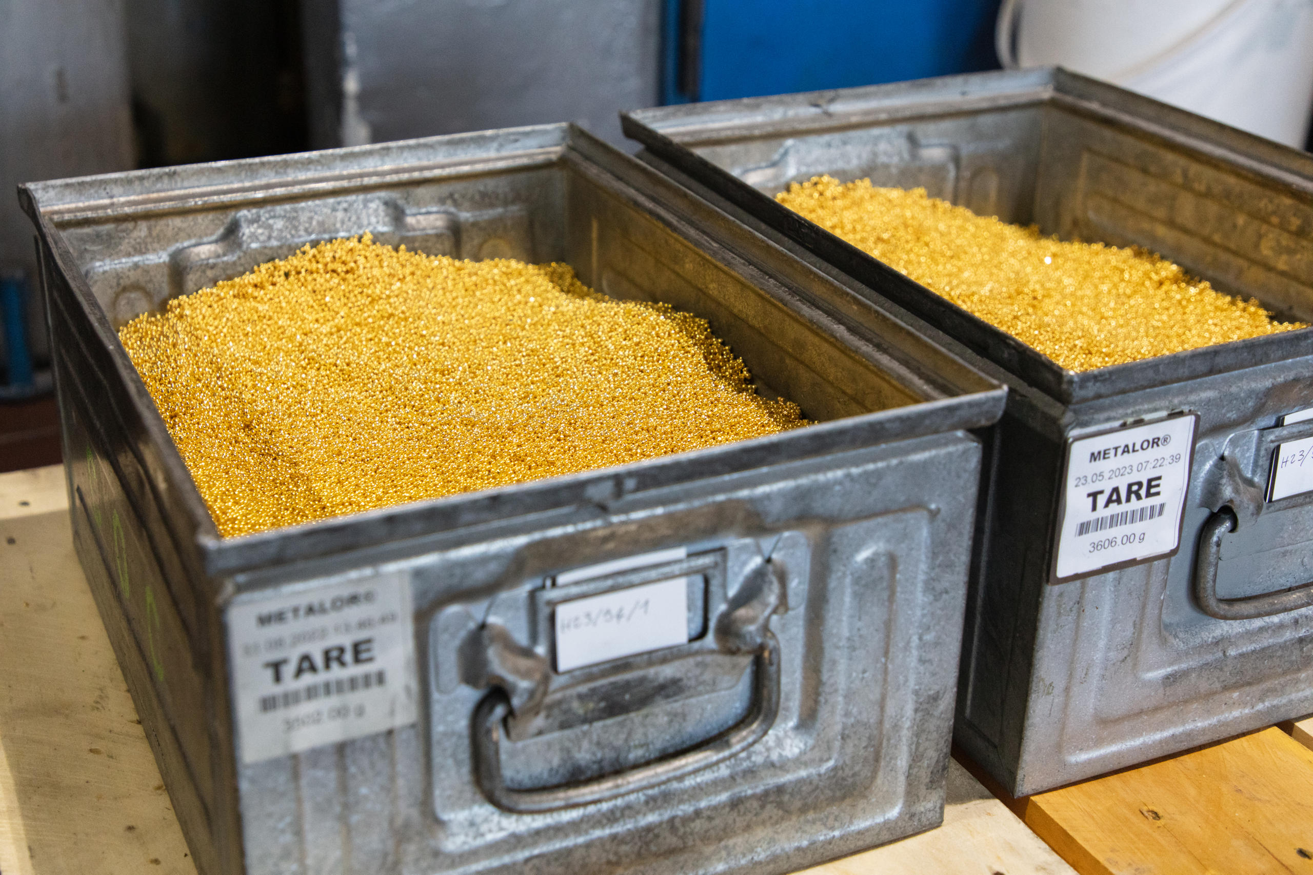 container filled with gold granules
