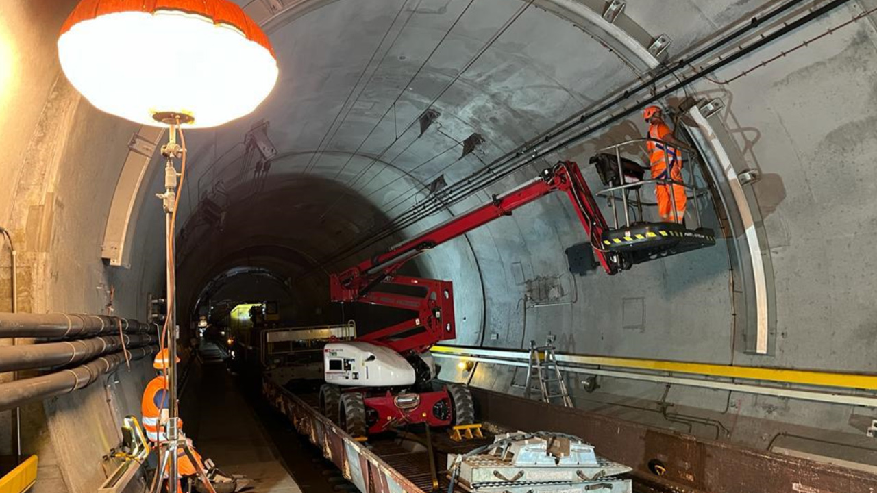 repair workers in a train tunnel