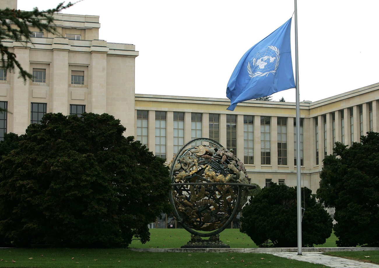 view of the palais des nations in Geneva, and the UN flag