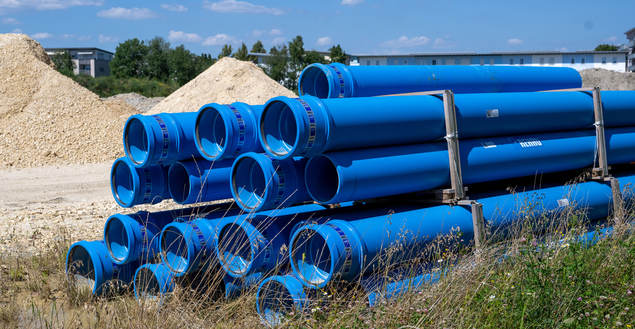 blue pipes by a construction site