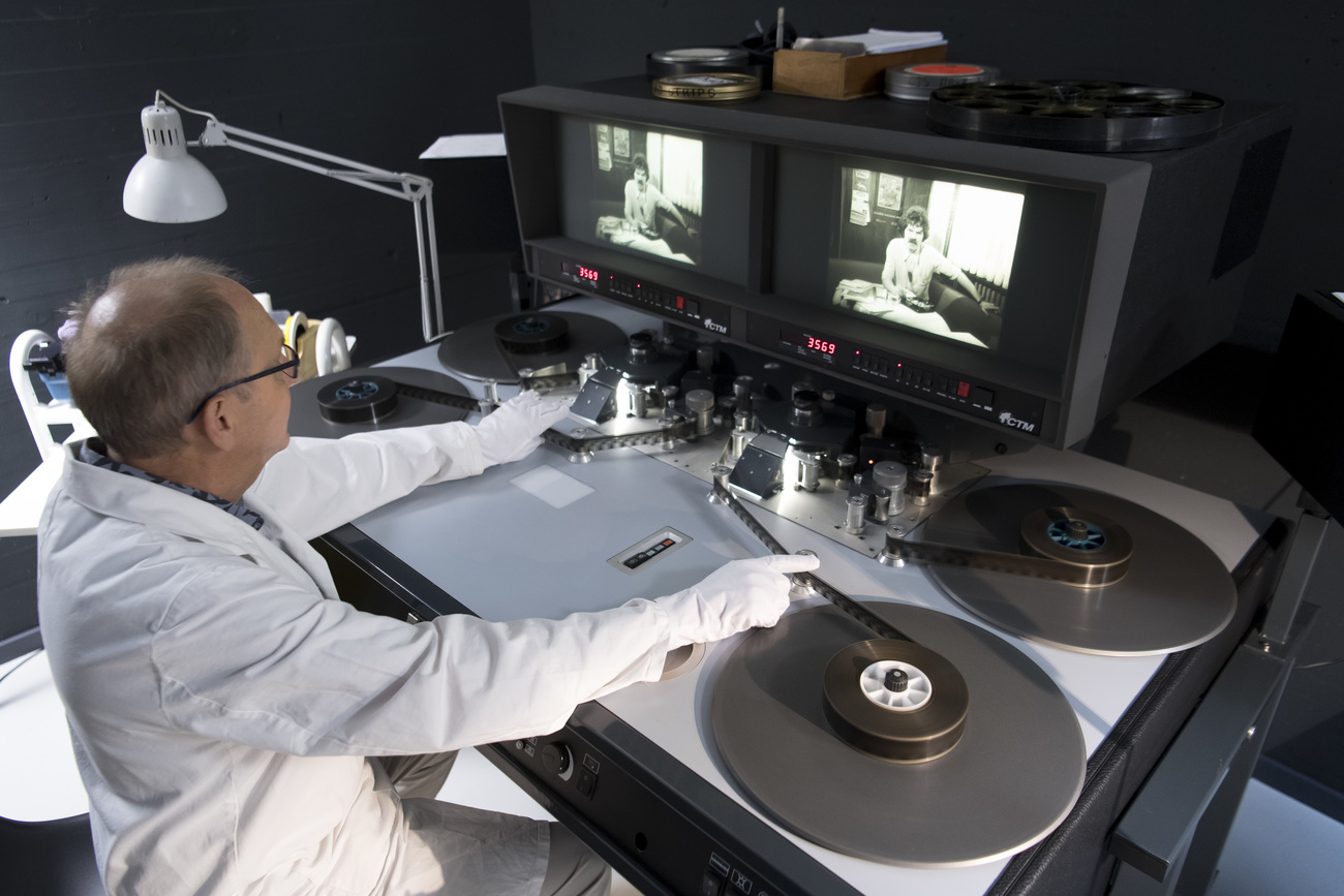 Technician operating a film editing machine at the Swiss Film Archives