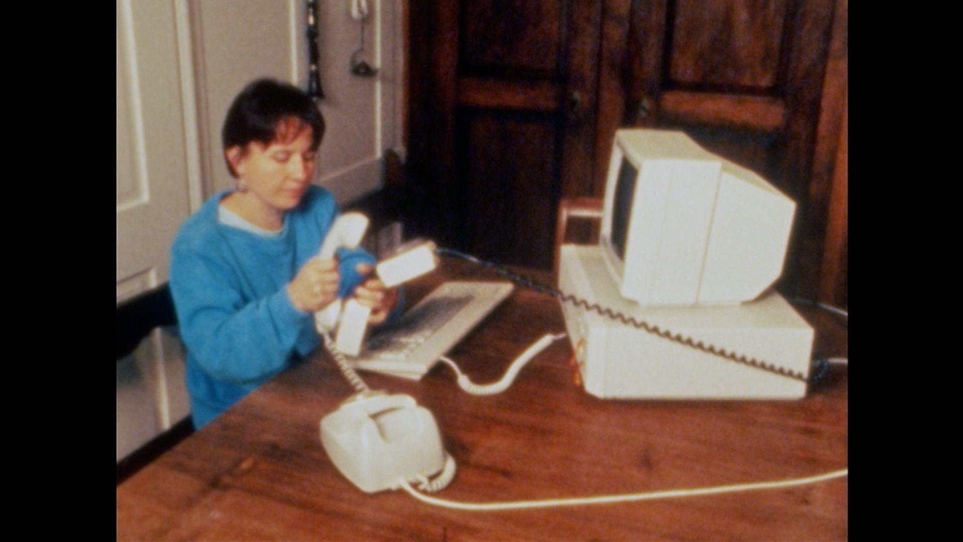 Woman sending a fax in the eighties