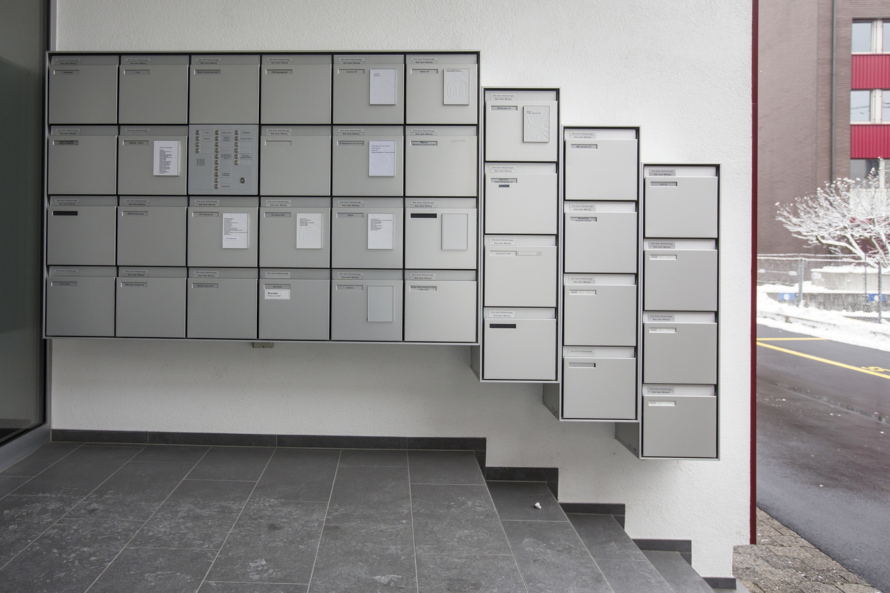 rows of letter boxes at entrance to building