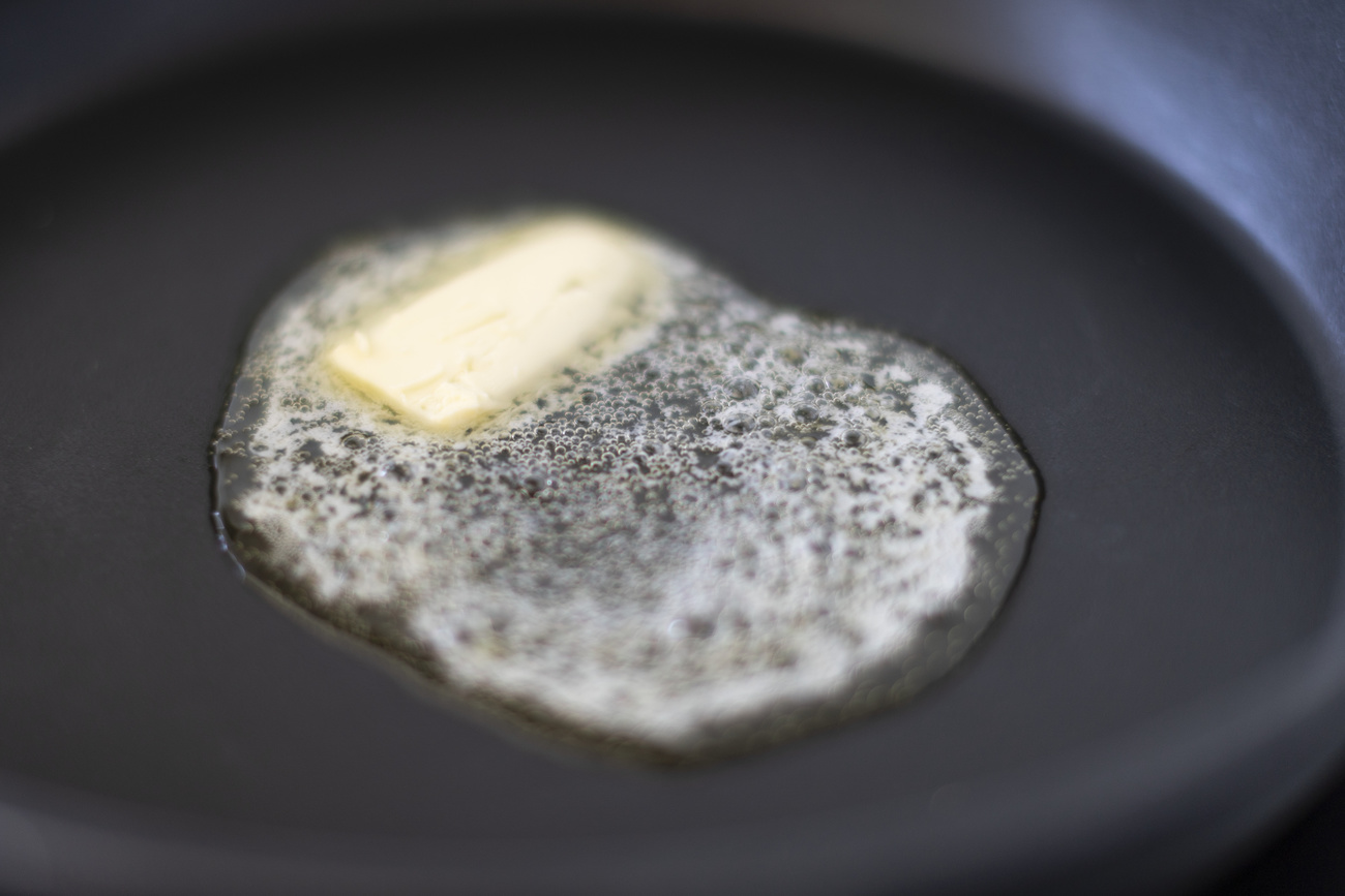 Butter melting in a frying pan