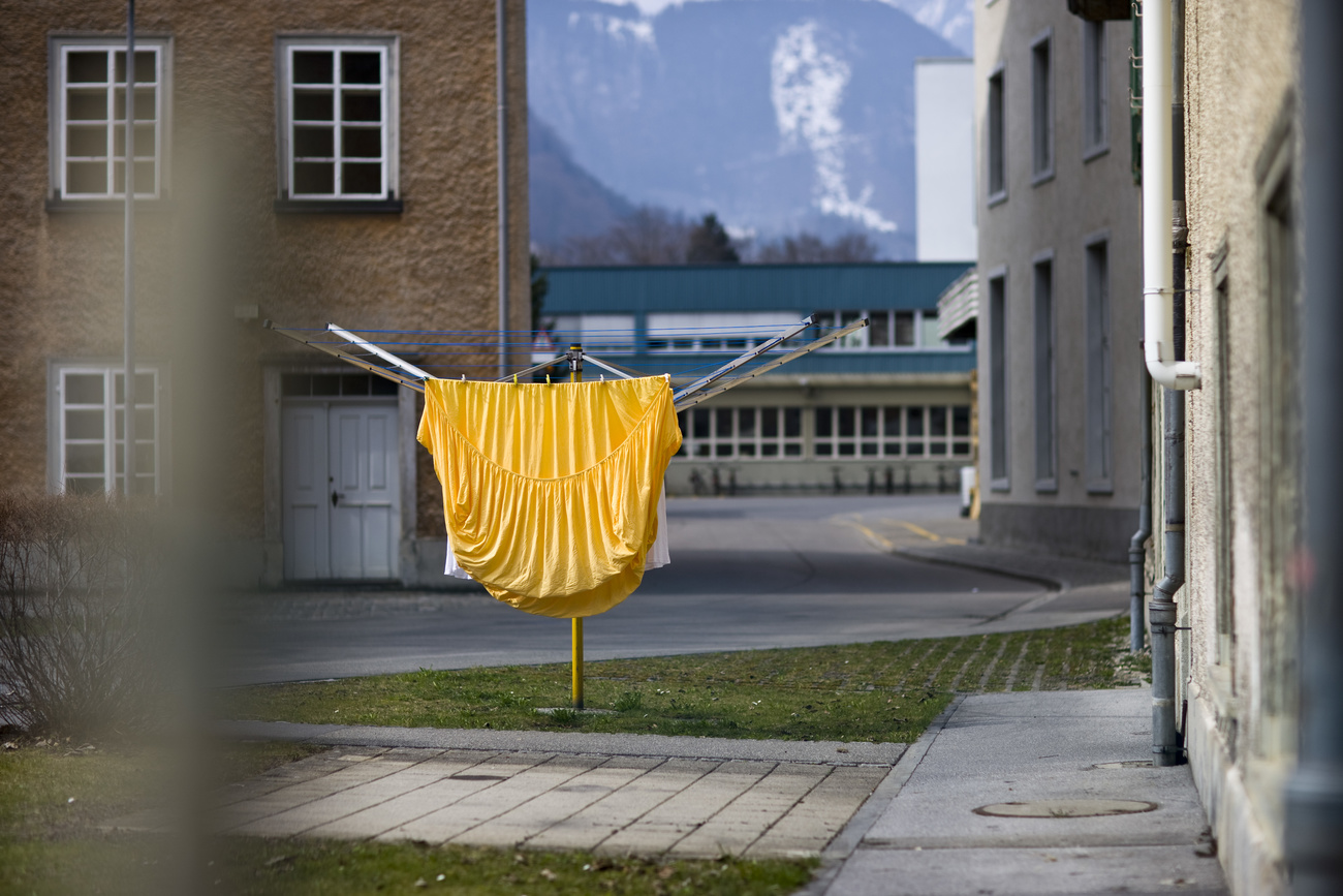 yellow bedsheet hanging on a washing line