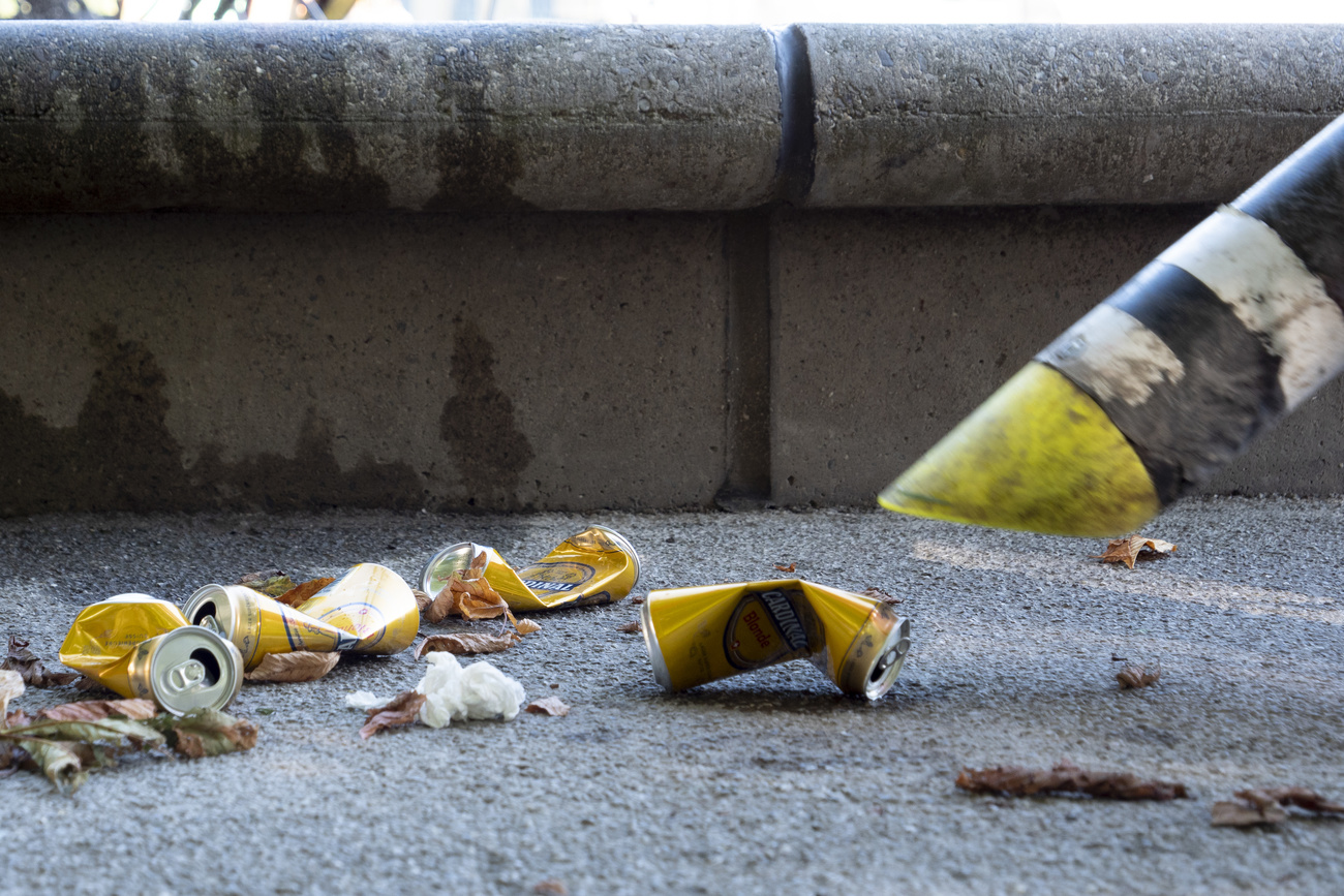 picking up cans thrown on the ground