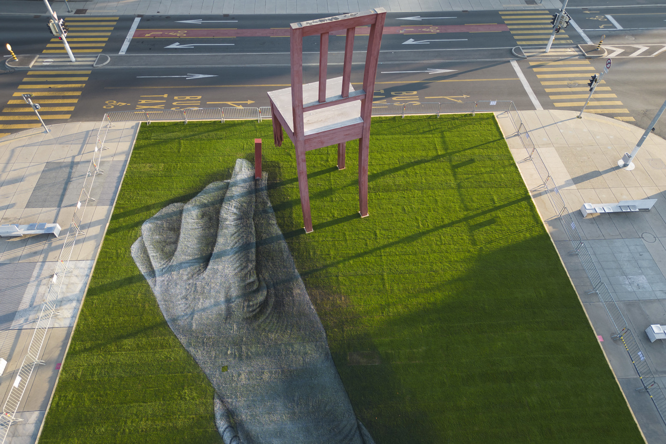 A giant biodegradable landart painting entitled All of us at the UN building in Geneva