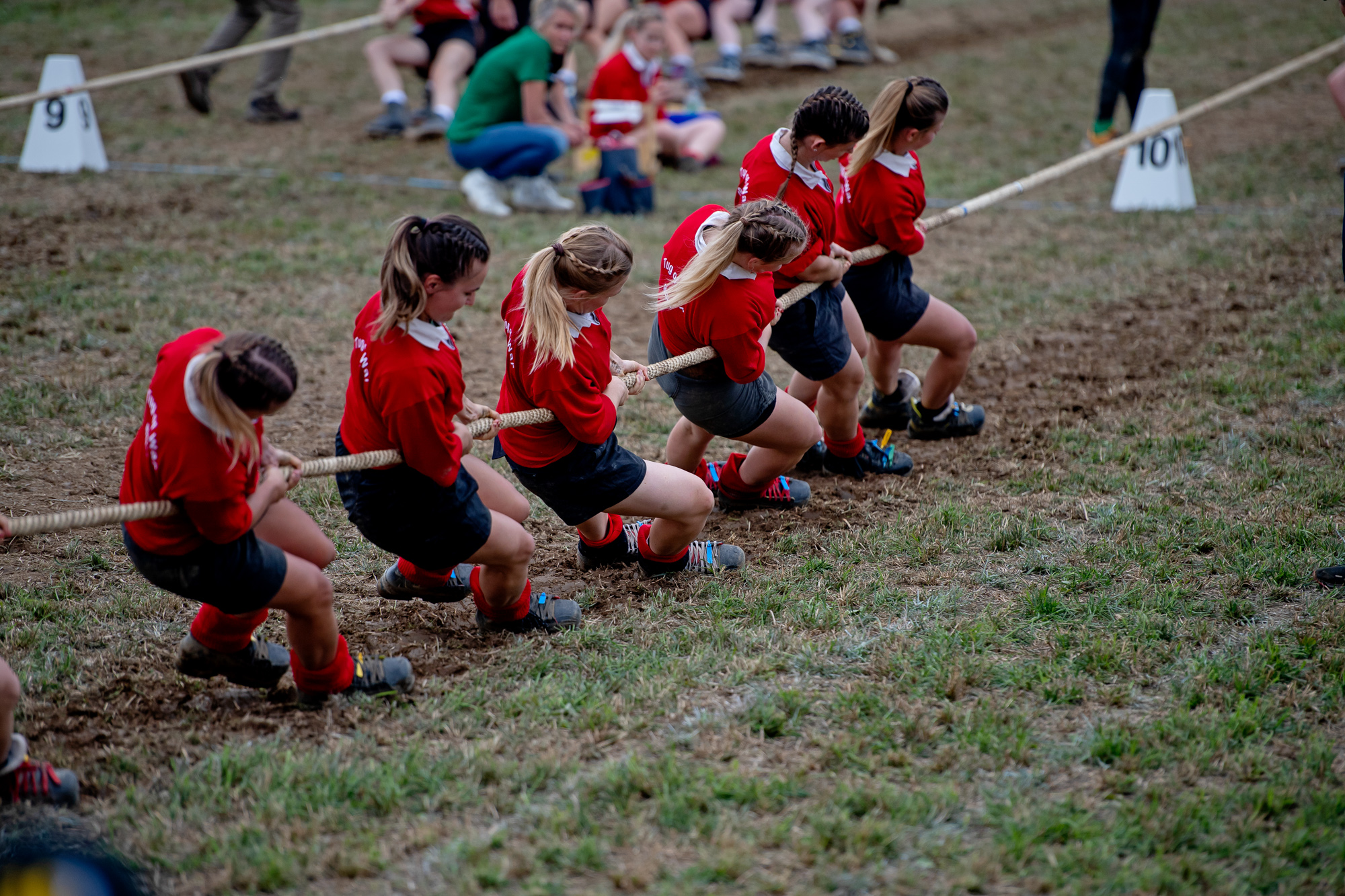 Photo of a team of women pulling a rope