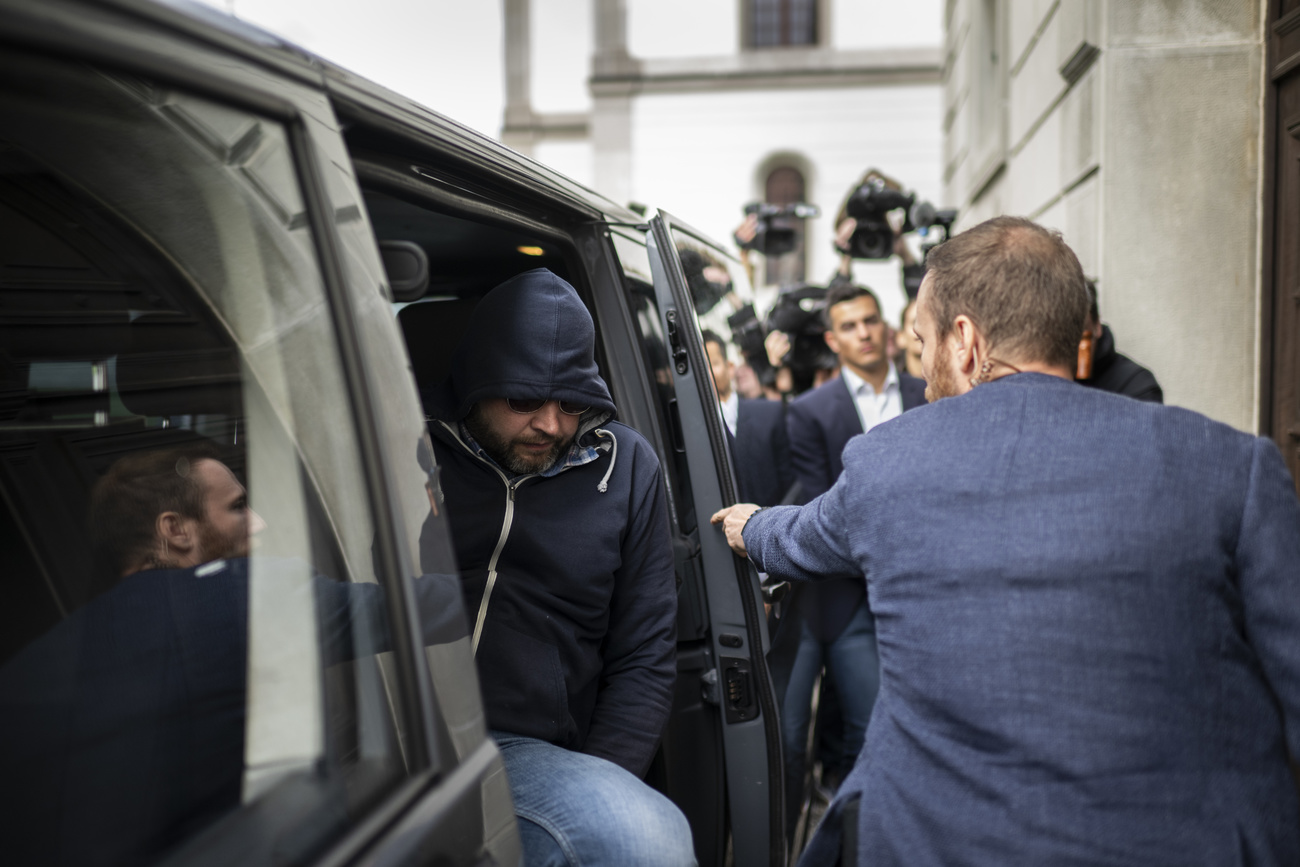 The defendant arrives at court