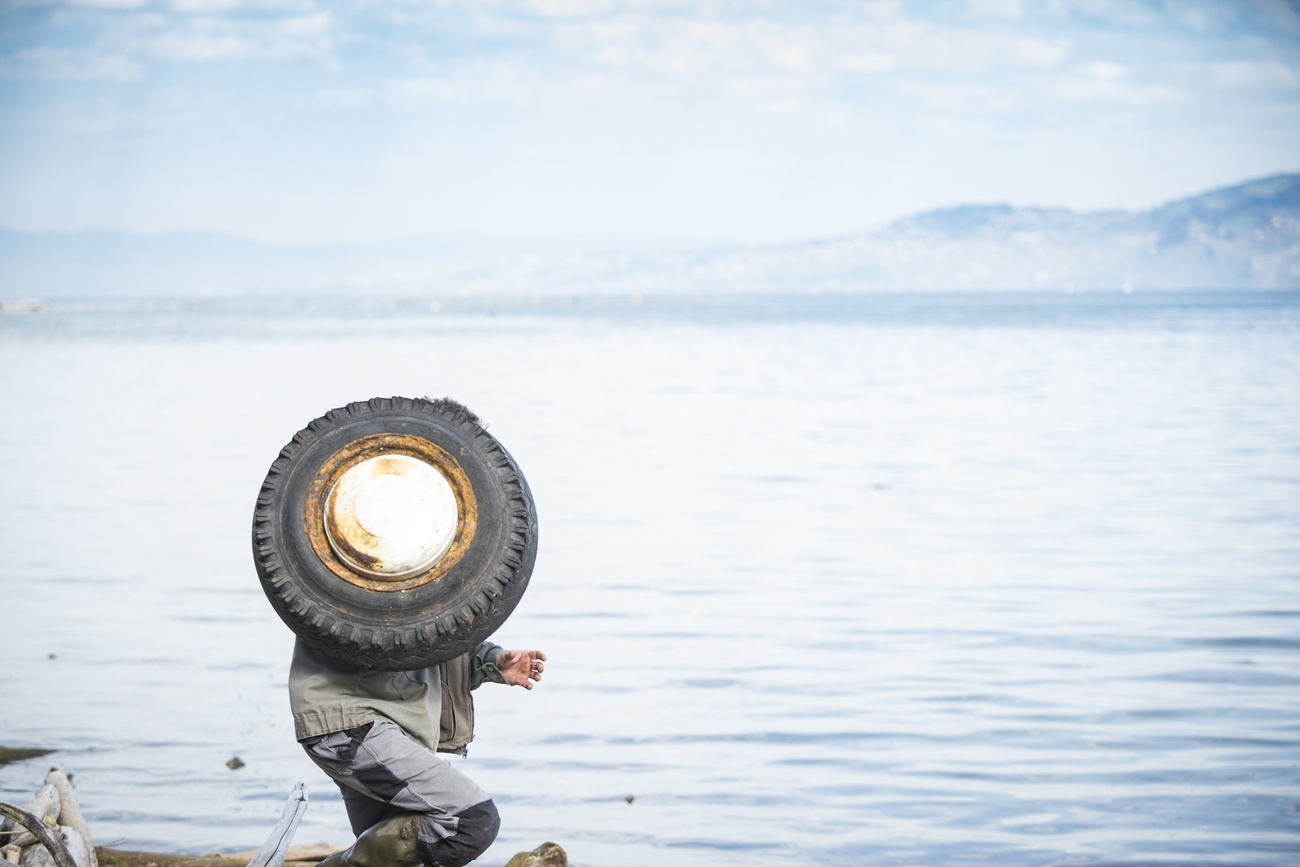 Pulling a tyre out of Lake Geneva