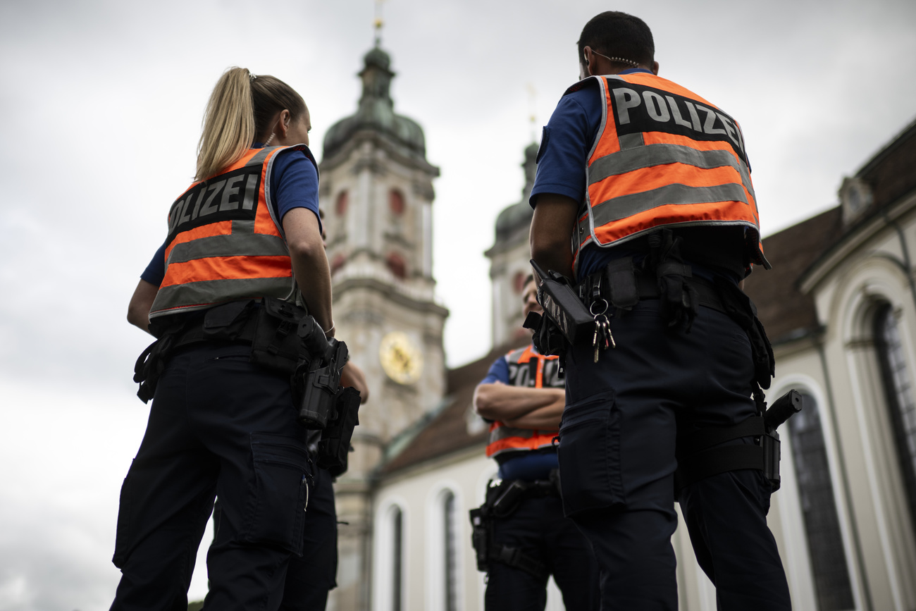 Police officers in front of a cathedral