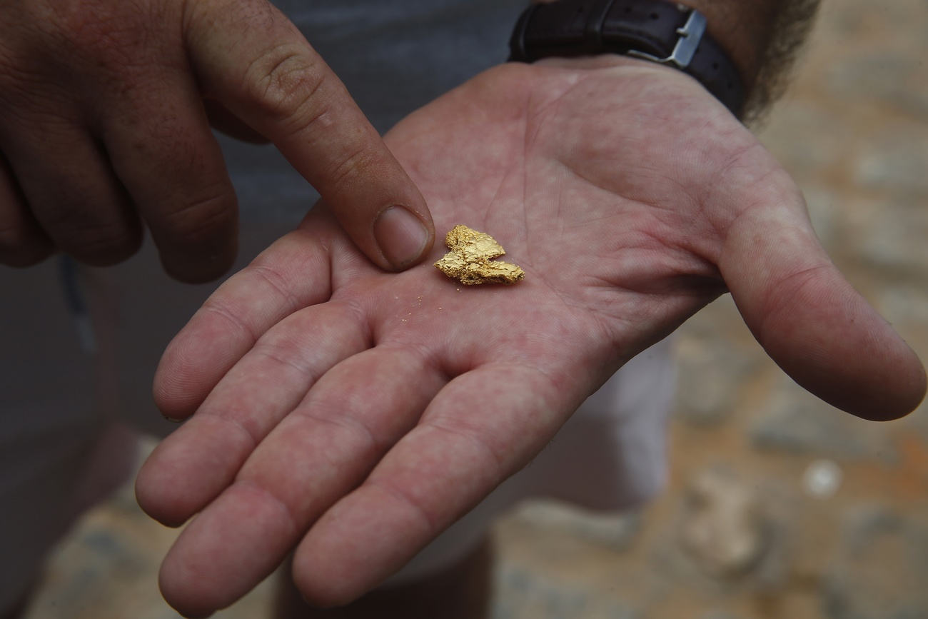 hand showing gold nugget