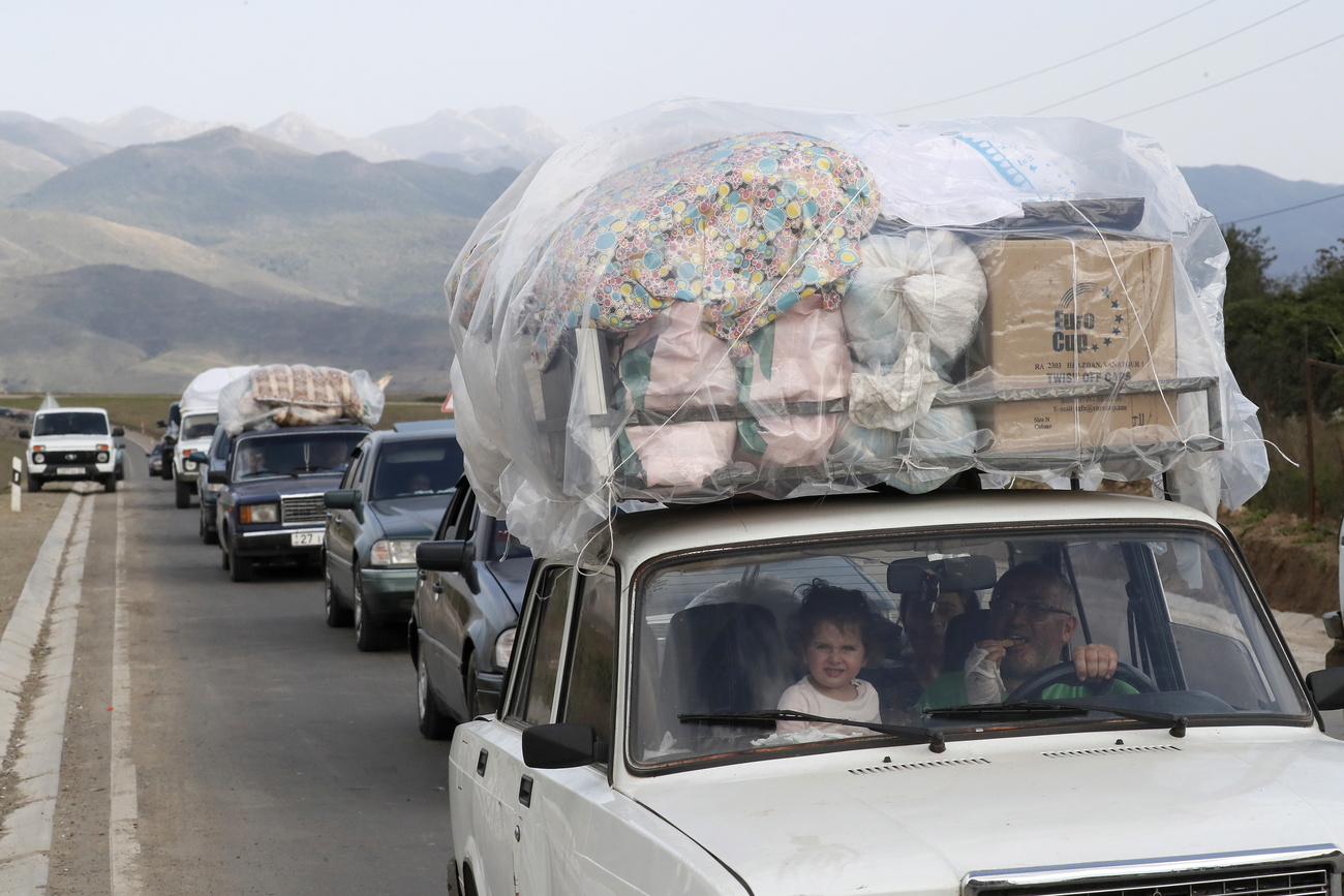 People flee Nagorno-Karabakh region.