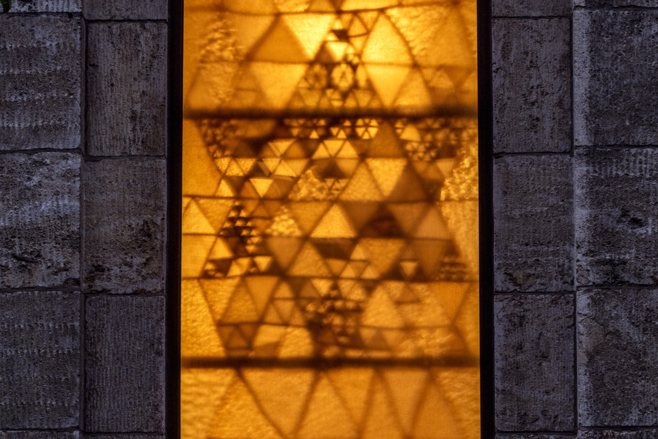 yellowish window of a synagogue with star of david