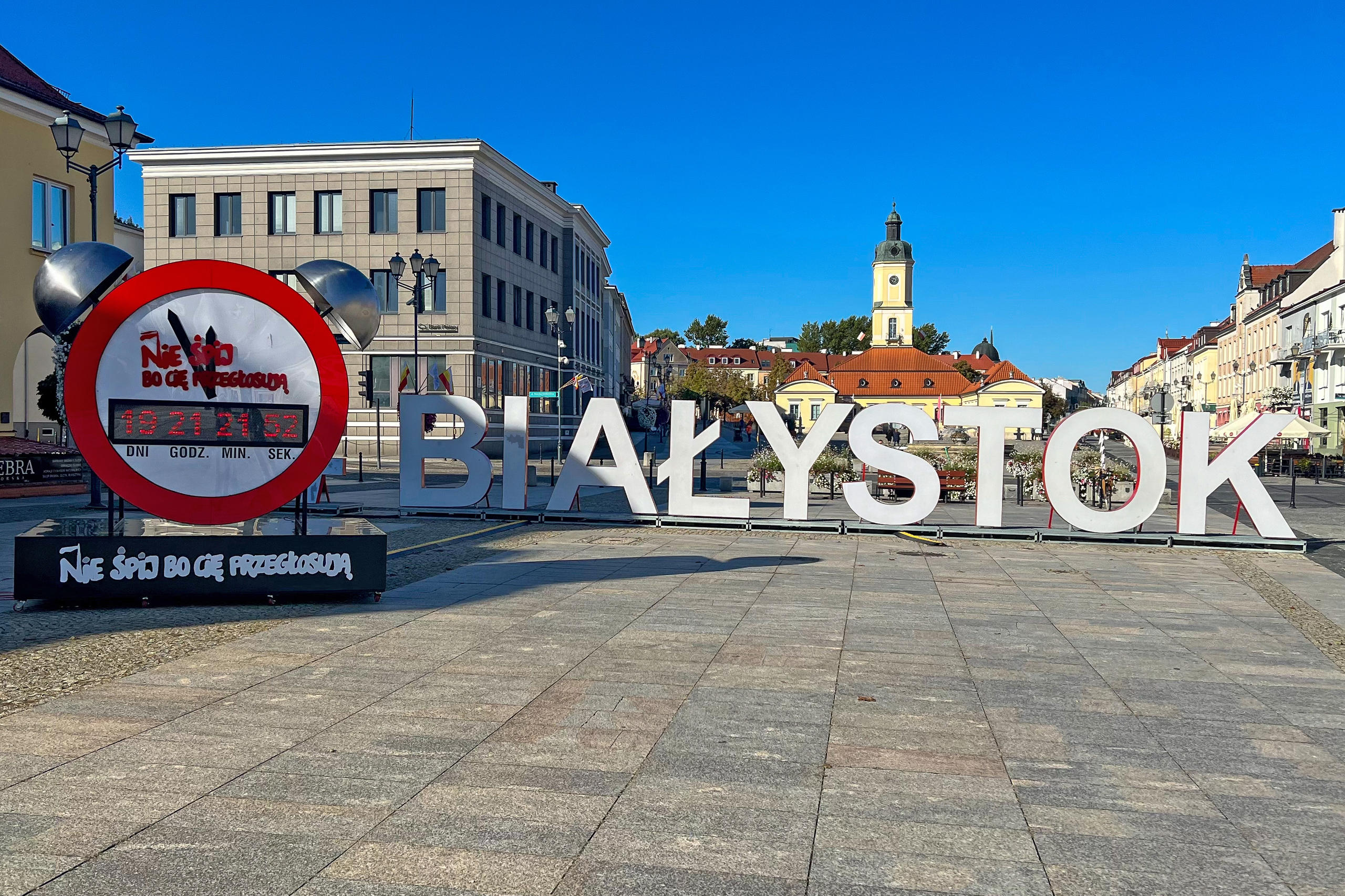 A large clock and the word “Bialystok” in equally large letters