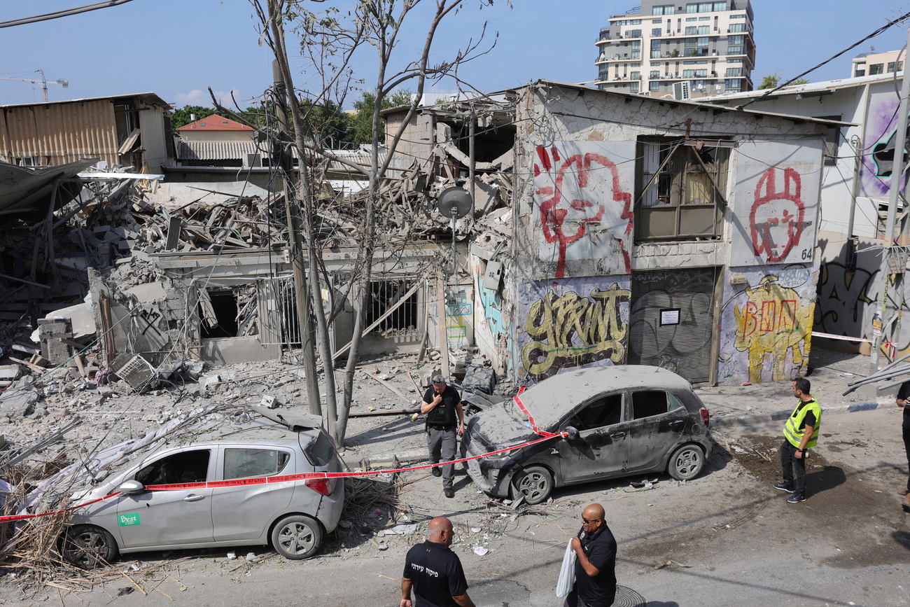 Police at the scene of a destroyed building in Tel Aviv, Israel, October 8 2023, following overnight Hamas rocket attacks.
