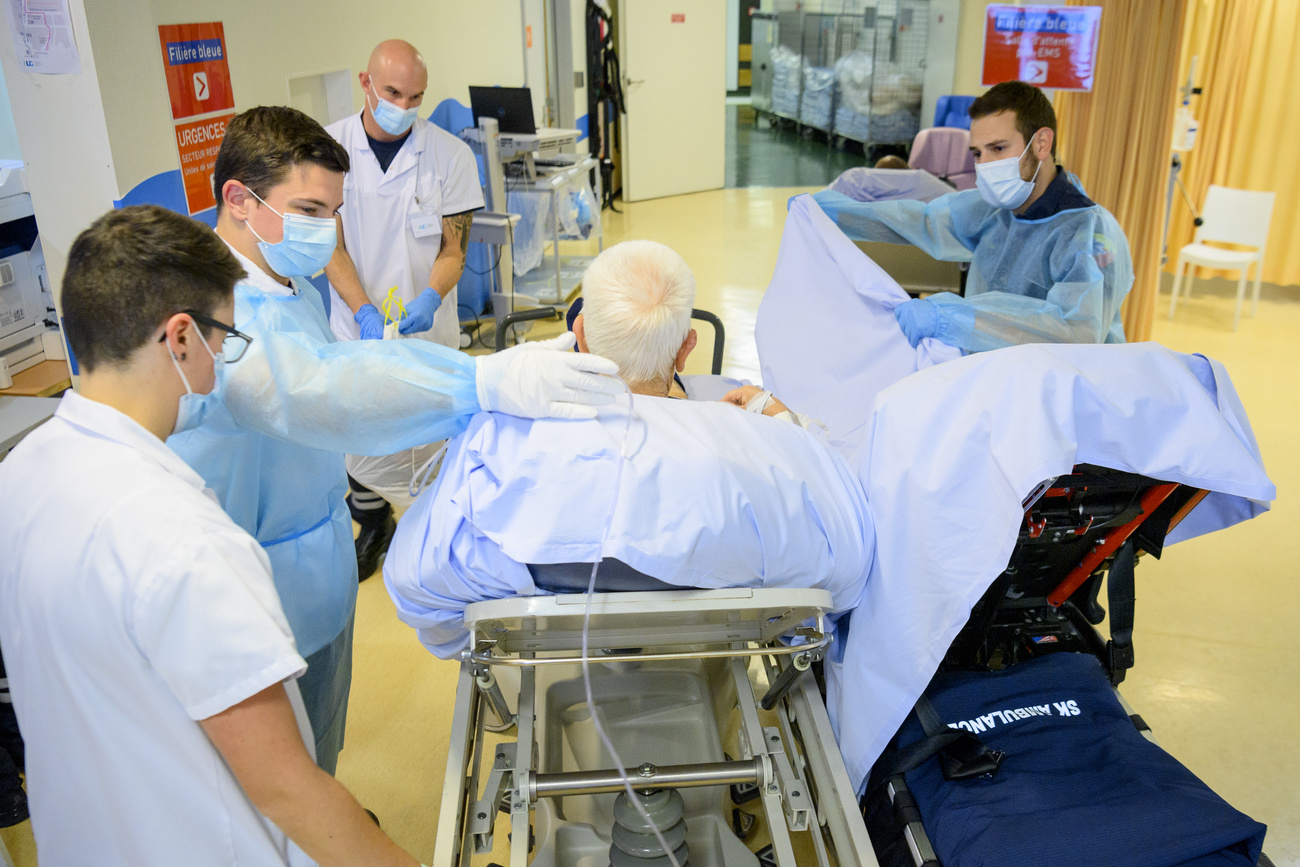 Masked doctors and patient in hospital