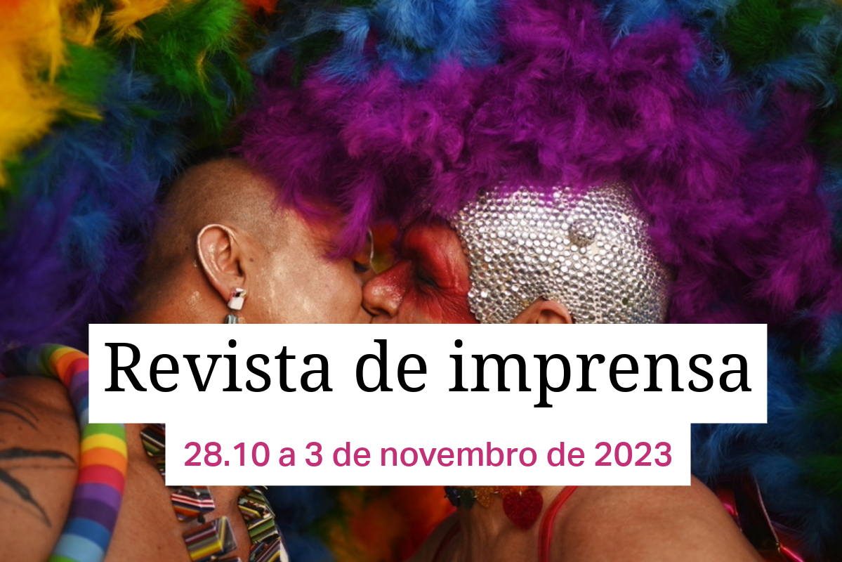 Duas pessoas se beijando com as cores do arco-íris no fundo