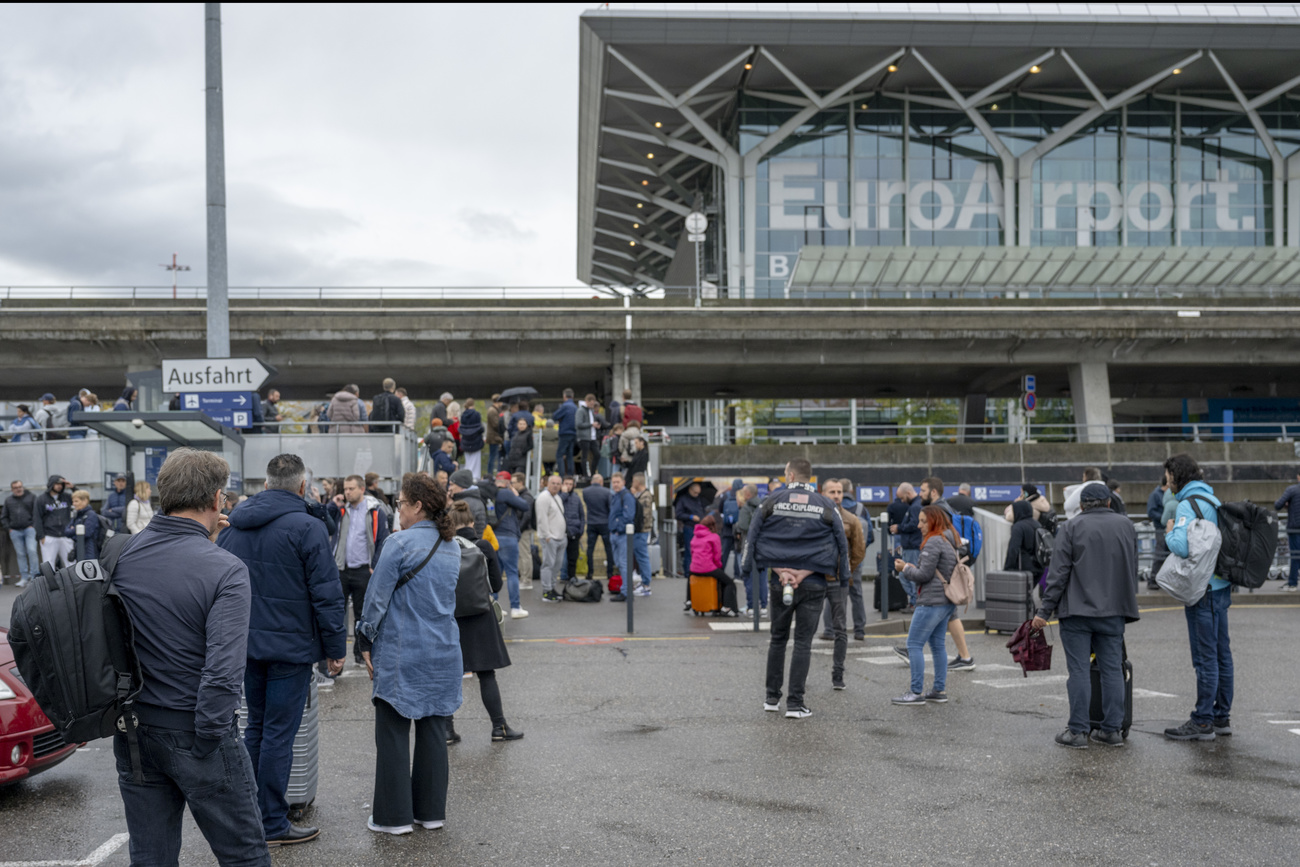 Passengers at EuroAirport outside the terminal building