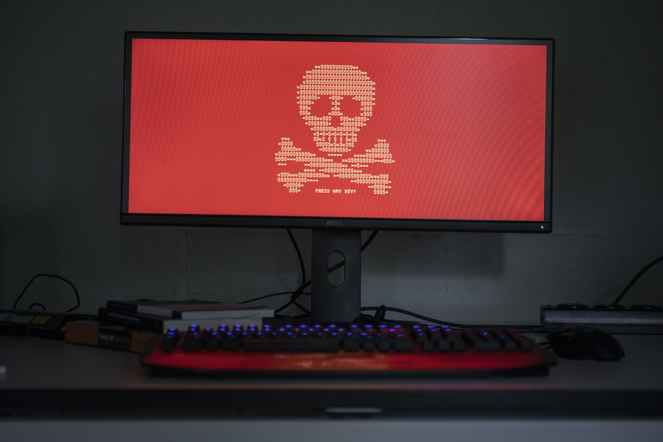 Computer with image of a skull on the screen