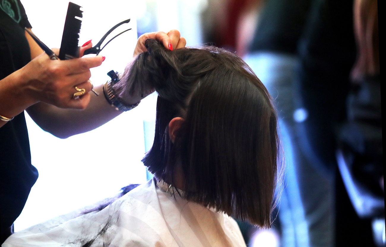 Woman getting hair cut
