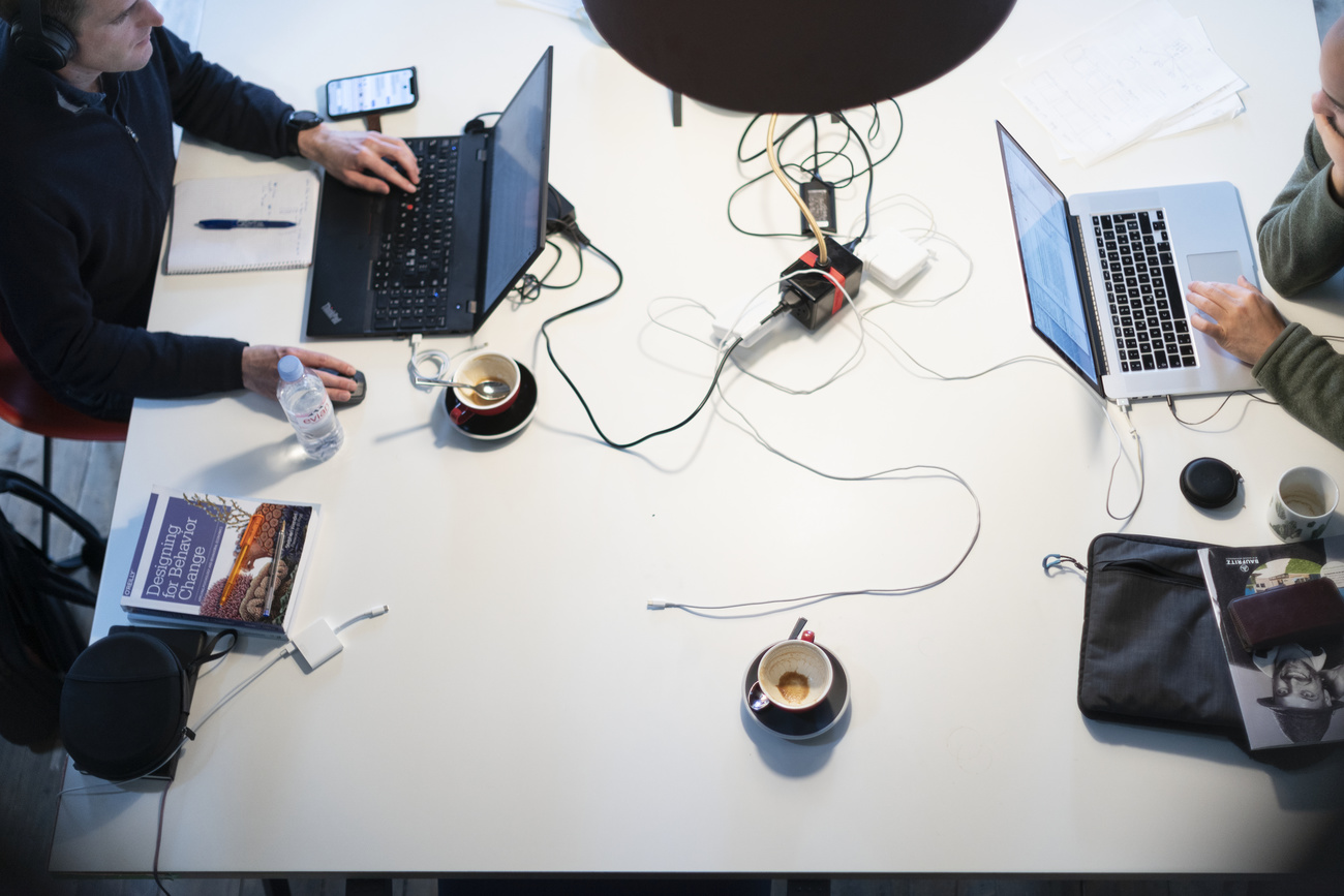 Workers at their laptops