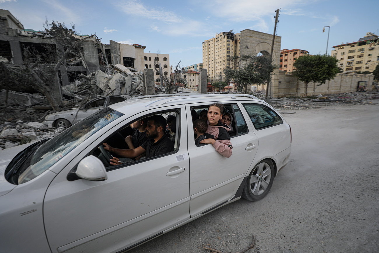 Palestinian family flee airstrike in Gaza Strip.