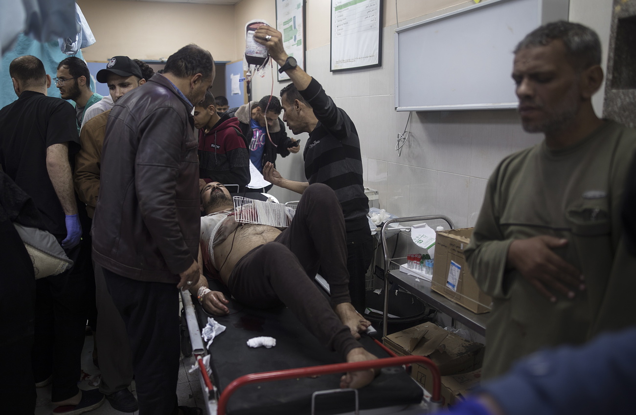 Injured man on stretcher in Gaza