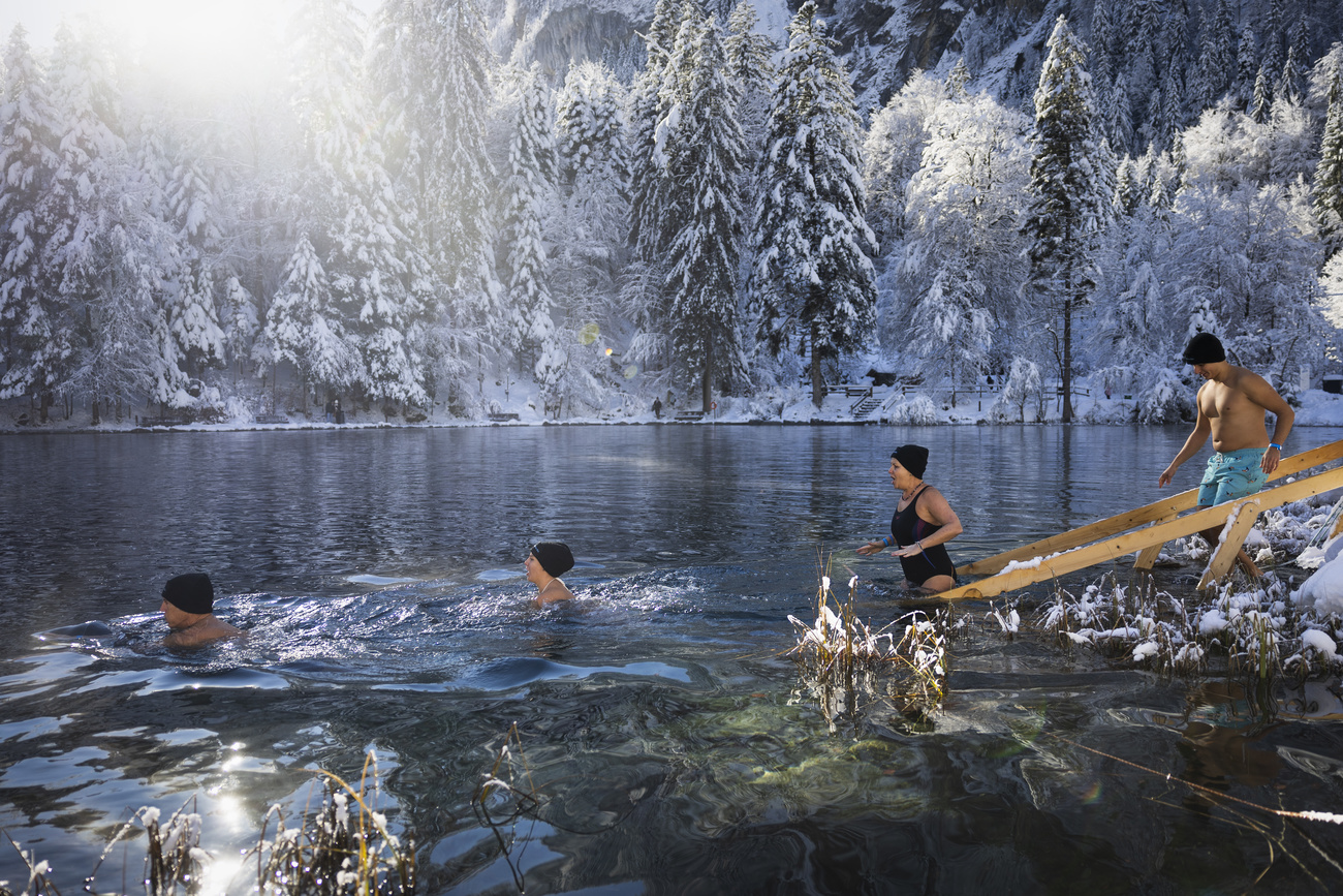 People swimming in Blausee in canton Bern.