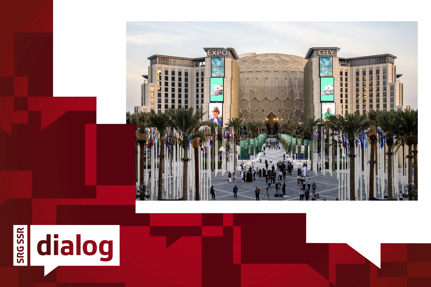 People walk at Expo Dubai, the venue of the 2023 United Nations Climate Change Conference (COP28)